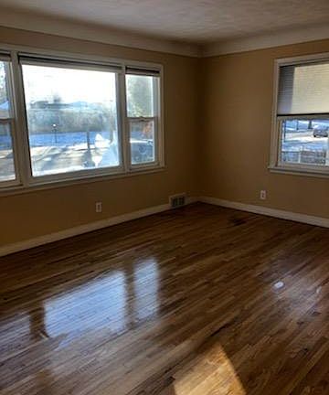 New picture window in the living room, lots of natural light. Hardwood floors refinished.