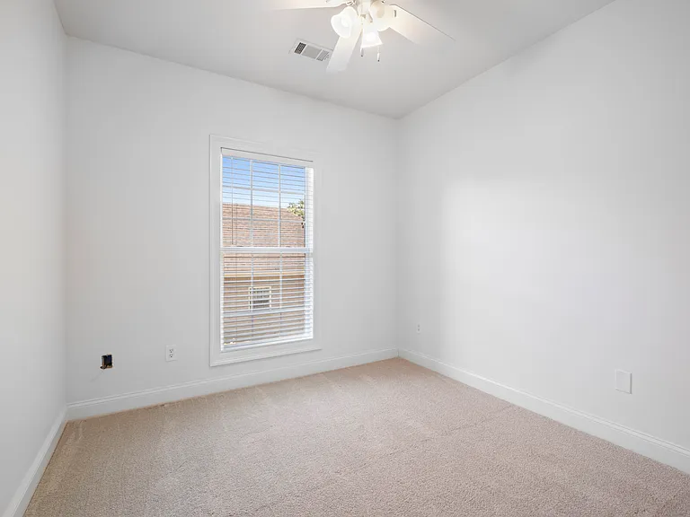Bedroom 4 has fresh carpet and new lighting.