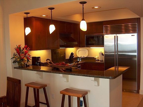 Granite, mahogany, stainless steel appliances