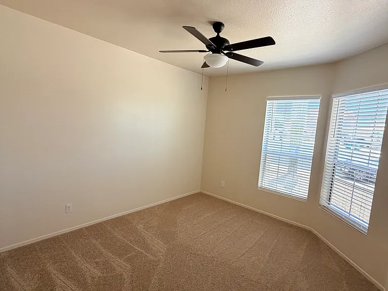 bright and spacious third bedroom with ample closet space