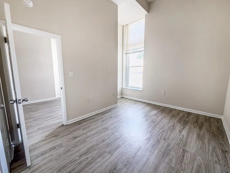 Comfortable Bedroom with High Ceilings