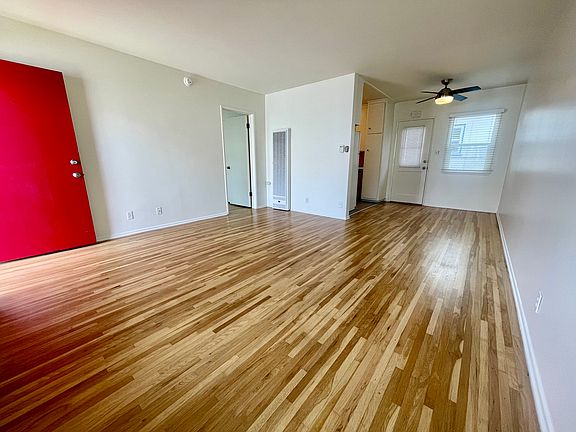 Bright spacious living area with beautiful hardwood floors