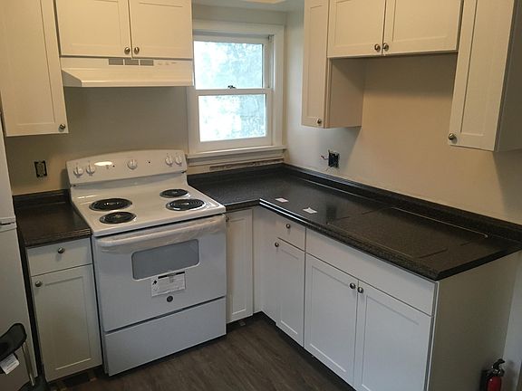 Brand new floors, cabinets and appliances in the kitchen.
