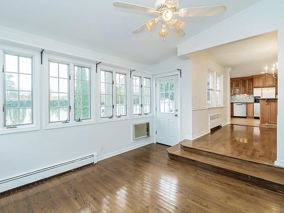 Bright and light Den with lots of windows and access to back yard offering a large deck and pool