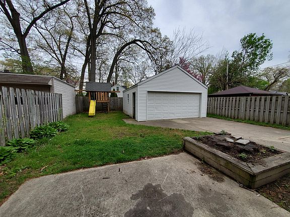 Fenced yard with playset