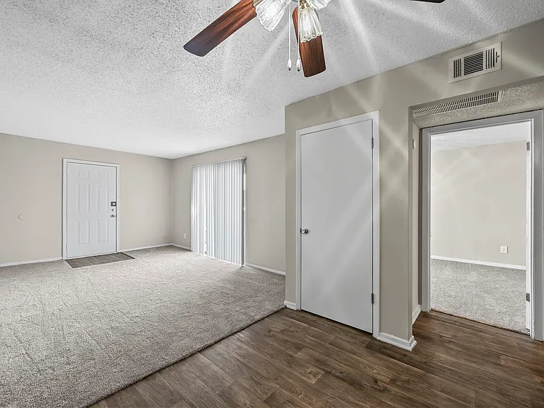 Spacious living area and coat closet.