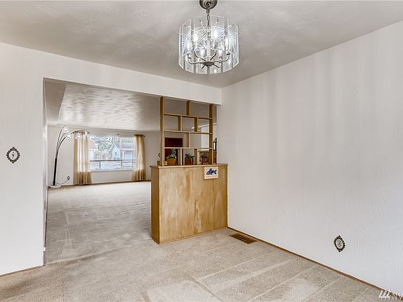 Built-in shelving unit right next to the formal dining room to store your fine china or books and other decor.