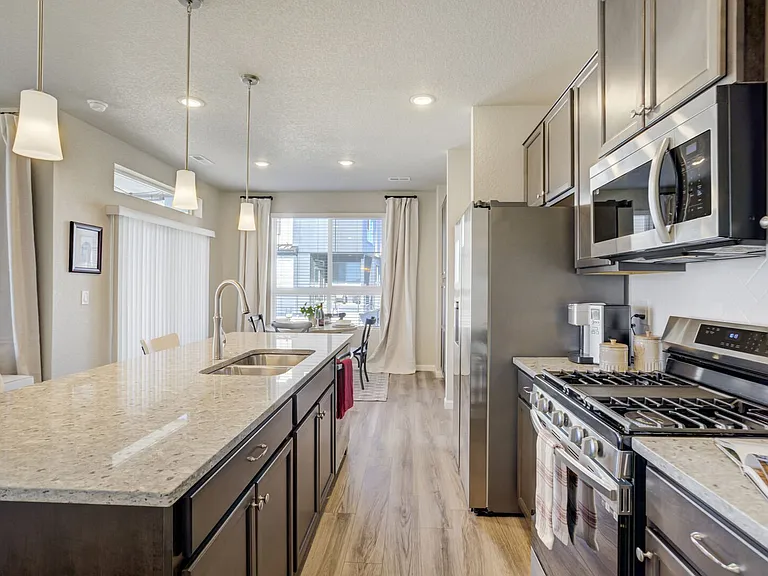 Kitchen
The kitchen features sleek, new appliances and everything needed for everyday meals.
