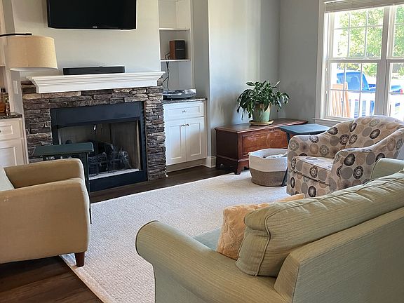 Living Room with Propane Fireplace and Book Shelves