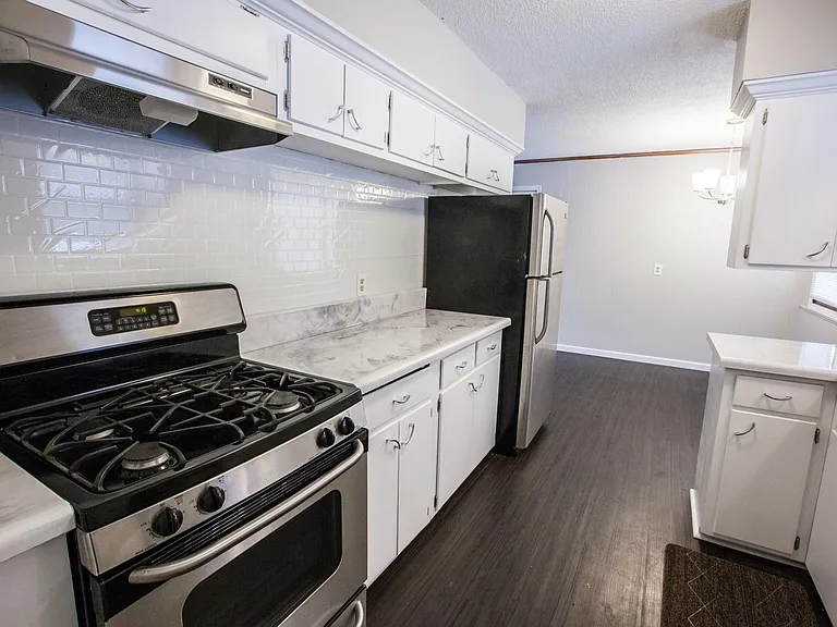 Kitchen. White cabinets and stainless steel appliances.