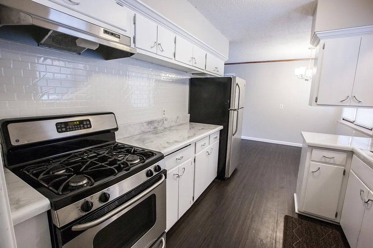 Kitchen. White cabinets and stainless steel appliances. - 1510 Circle Dr