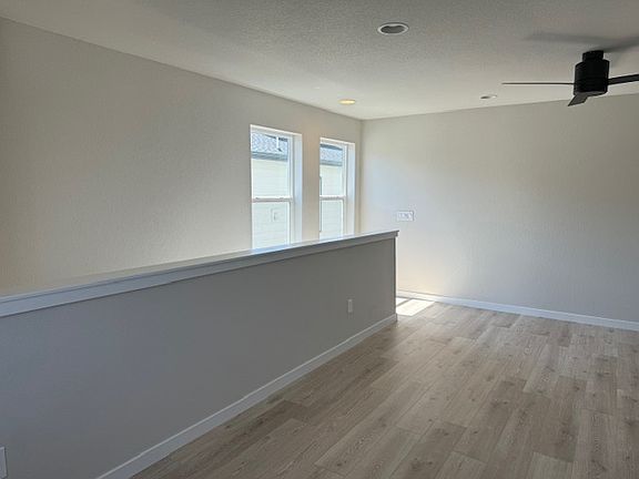 View from kitchen to living room and staircase entry
