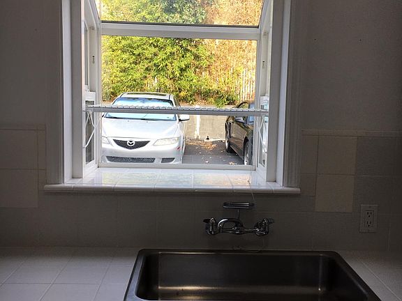 New garden window with white tile ledge