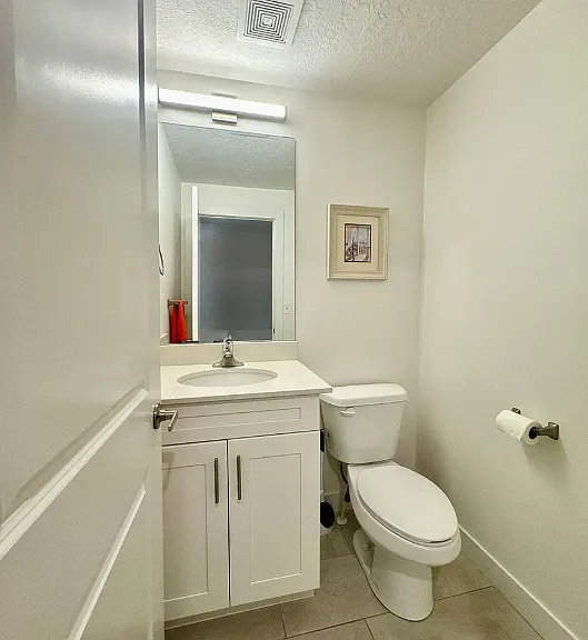 Bathroom #2: Half bathroom from 2nd floor with single vanity (sink and toilet)