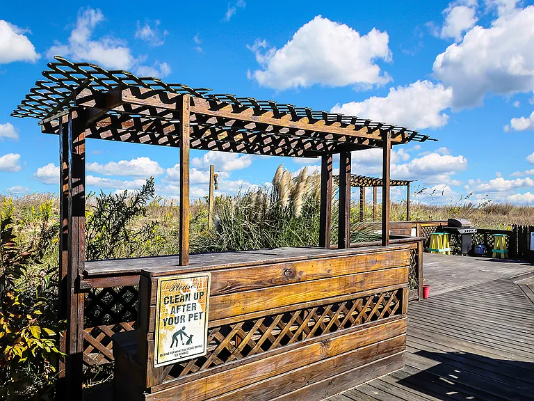 1,000 square foot beachfront deck with 2 gazebos, swing, grilling station, and beach shower
