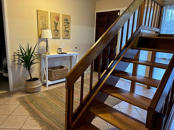 Gleaming hardwood staircase to upper floor