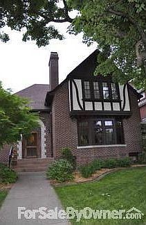 Charming Tudor with arch front door
						:
						Home has original front soildwood front door with beautiful oval window.