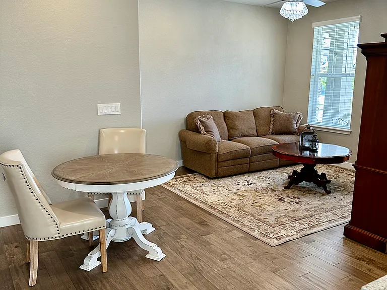 The kitchen nook features an expandable table with seating for two to four people, depending on your needs. This bright and inviting space is filled with natural light, making it perfect for dining, working, or enjoying your morning coffee.