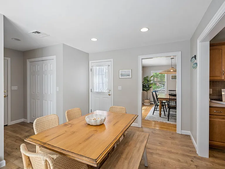 Kitchen eating area. Dining room in background.