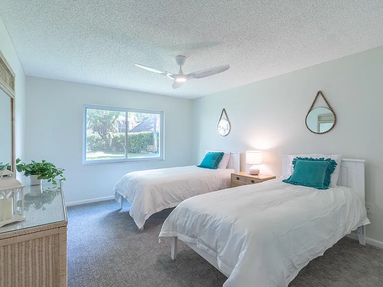 Guest bedroom with brand new mattresses, twin XL