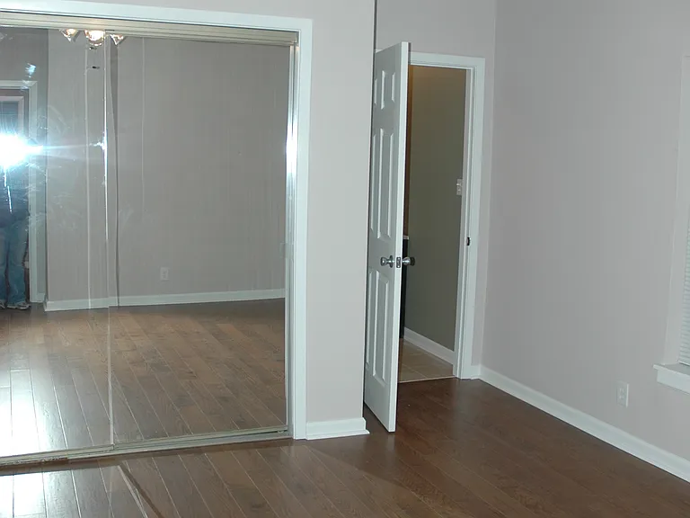 Master Bedroom with large closet, ceiling fan, and private bathroom.