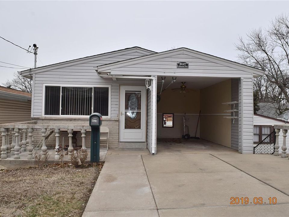 Welcome to 8027 Lakewood Ave 63123, enclosed carport and large driveway with a large front patio welcome you home.