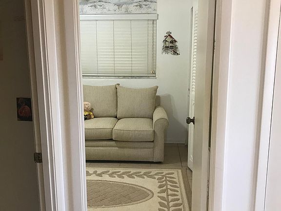 Hallway to bedroom 2 loveseat is pull out for guest