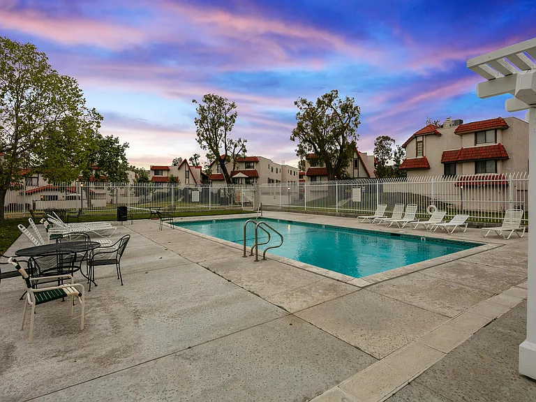 Slip into the cool embrace of the pool's depths or bask in the sunshine on comfortable lounge chairs lining the poolside.