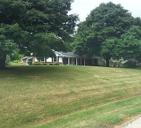 Surrounded by trees, corner lot