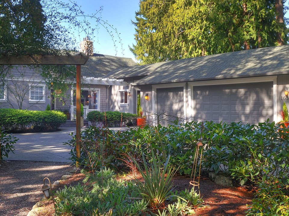 Front Door & 3 car garage
