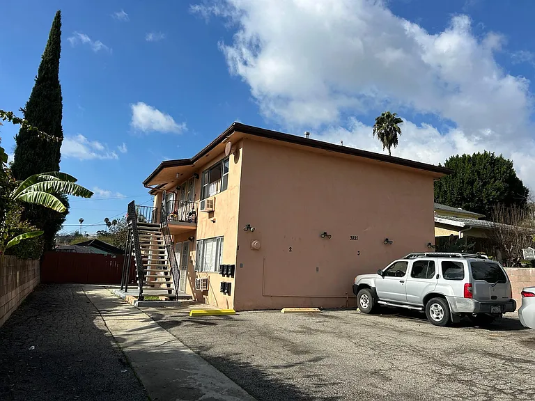 Unit #4 is an upper apartment on the left with a view of neighborhood. Tandem parking included for 2 cars in front of building. The building has four units total.