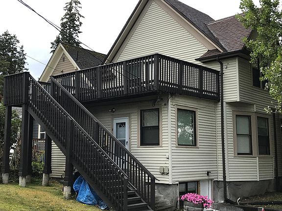 Back of the building with stairs & deck for unit #2