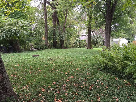 Lovely relaxing fenced in back yard with fire pit