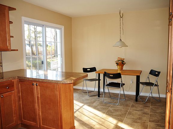 Updated kitchen with new sliders to the back yard, beautiful tile floor.