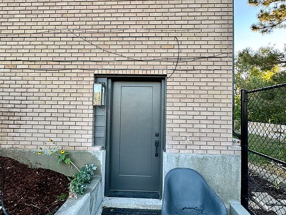 Apartment front door. Access to the back yard.