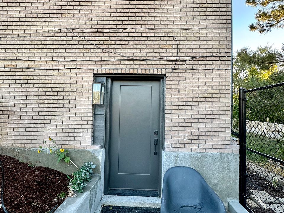 Apartment front door. Access to the back yard.