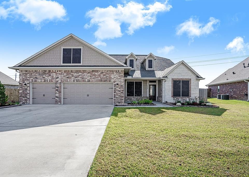 Front Elevation-look at that wide driveway