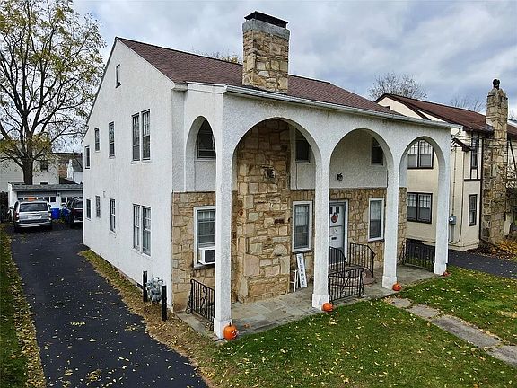 front and side of house. Driveway.