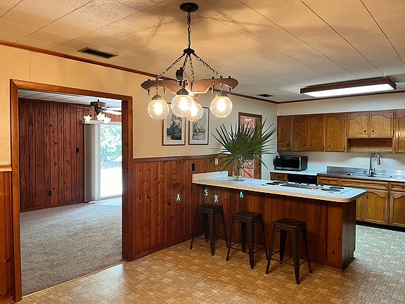 View (to North) from Dining/Kitchen with Breakfast Bar through to Family Room