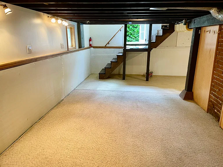 Basement den/office space with access to back yard.