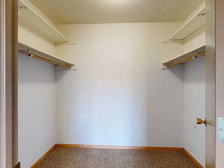 Enjoy the convenience of a walk-in closet with ample shelving and hanging space.