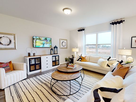 Sit back and relax in the spacious Gathering Room - Model Representation