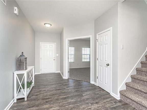 Open and inviting entry with a "flex" room immediately off of it. Plenty of possibilities as an office, music or sitting room OR kids playroom! Close the double doors to hide the toys when not in use!