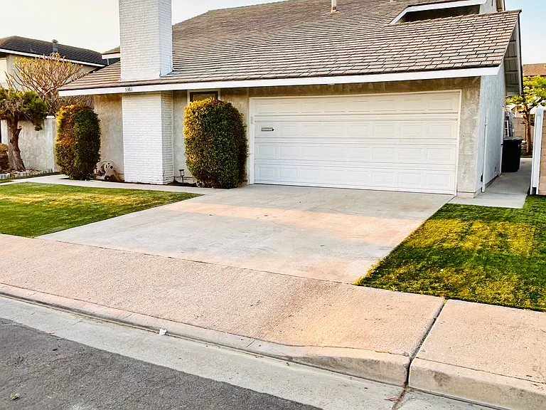 2 car garage and driveway, side gated entrance