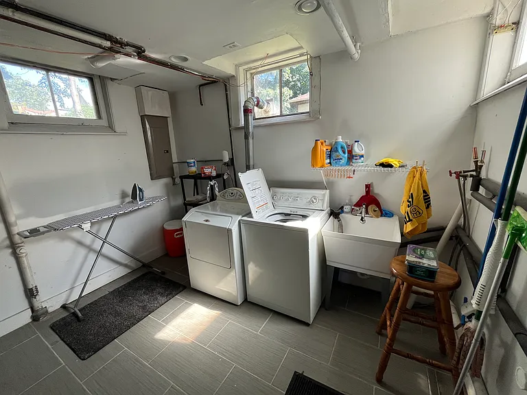 Even the basement gets great light. Washer, dryer, and ironing board