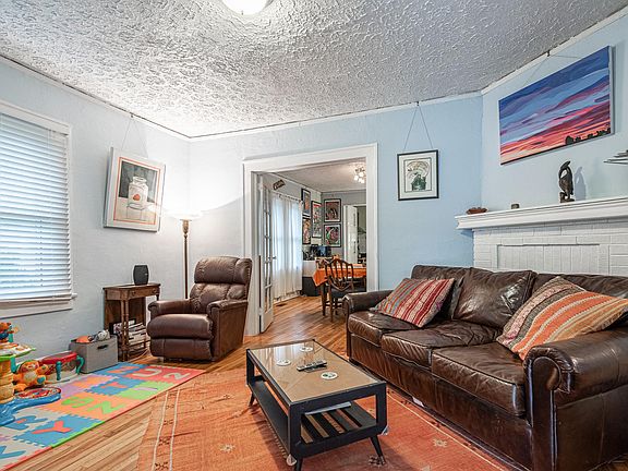 Enter front door and you are in the living room (fireplace does not function)