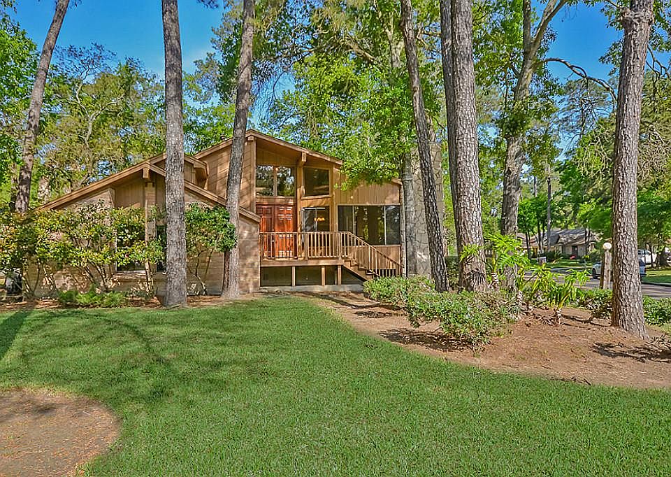 Large front yard with lots of mature trees welcome you to 330 Cypresswood