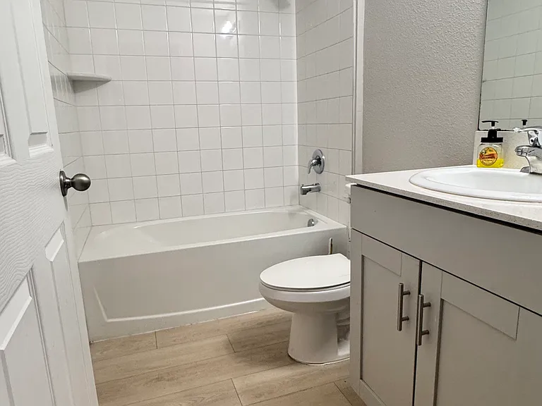 Full Bathroom #2 with a linen closet