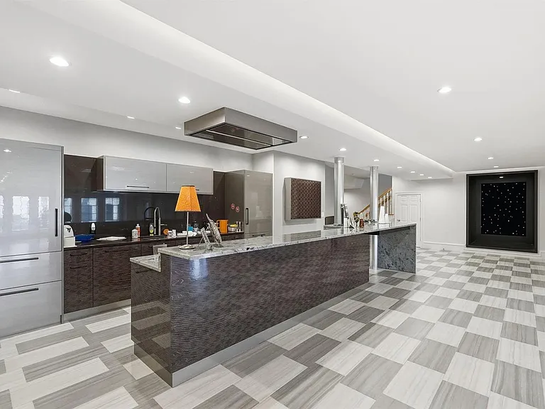Sleek modern lower level kitchen.