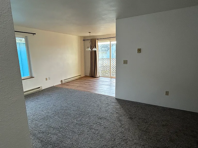 Living area leading to dining area and kitchen on 2nd floor